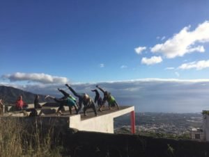 Volunteers and members morning meditation at Life Central Station alternative community in Tenerife