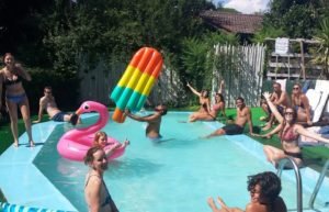 Volunteers in Italy enjoying swimming pool at Wiki hostel in Lazio region