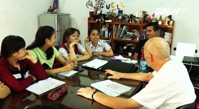 disabled man helping teaching english in vietnam