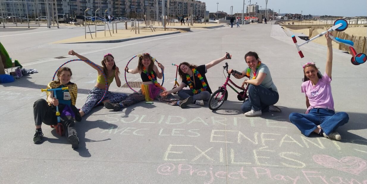 Project Play volunteers doing outdoor play activities for children during a community volunteer project