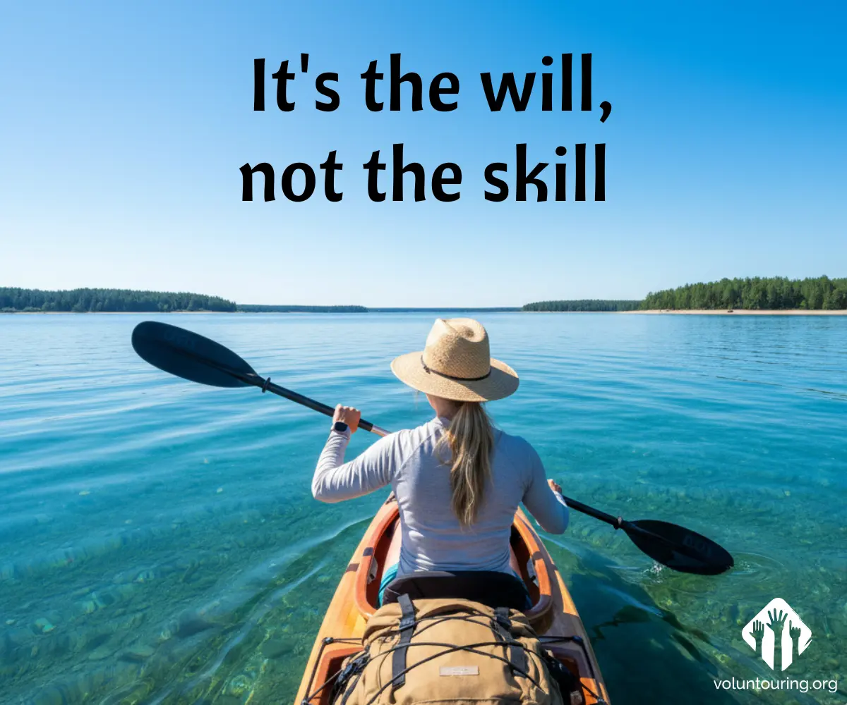 Woman paddling a kayak on crystal clear blue water, wearing a straw hat, with forested islands in the distance. Quote on the image reads, “It’s the will, not the skill.”