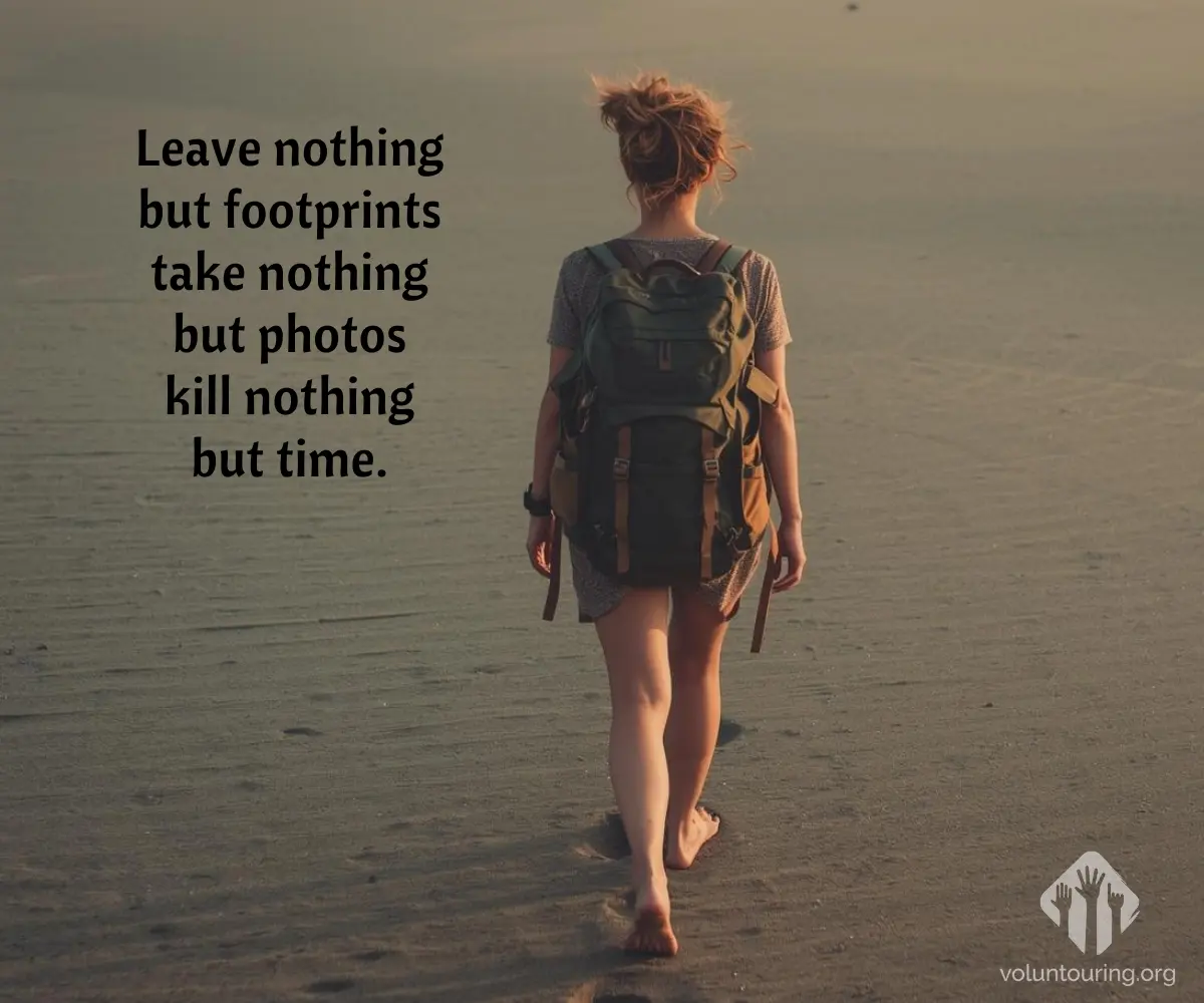 Back view of a solo traveler walking barefoot on a sandy beach at sunset, carrying a large backpack. Quote reads, “Leave nothing but footprints, take nothing but photos, kill nothing but time.”