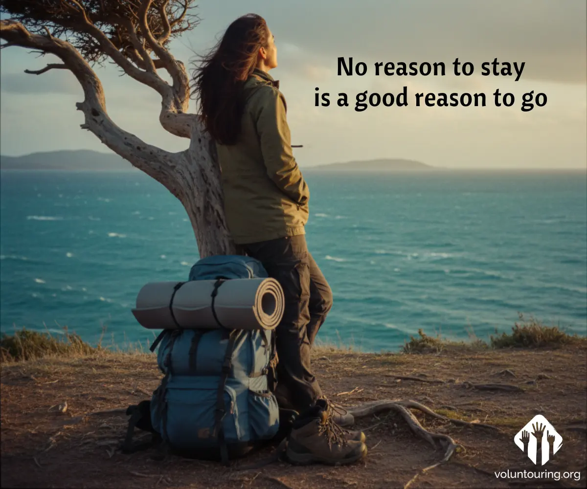 Backpacker leaning against a wind-shaped tree on a coastal cliff, large blue pack with sleeping mat on the ground, looking over a rough sea at sunset. Quote reads, “No reason to stay is a good reason to go.”