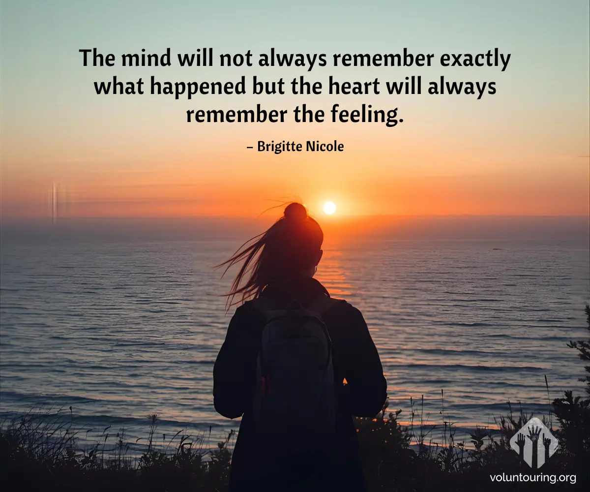 Silhouette of a woman with a backpack watching a vivid orange sunset over the ocean from a cliffside. Quote on the image reads, “The mind will not always remember exactly what happened but the heart will always remember the feeling,” credited to Brigitte Nicole.