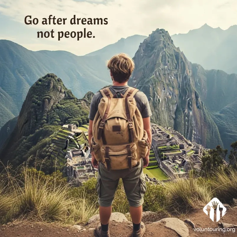 Traveler with backpack overlooking Machu Picchu with inspirational quote 'Go after dreams not people' and voluntouring.org logo in corner.