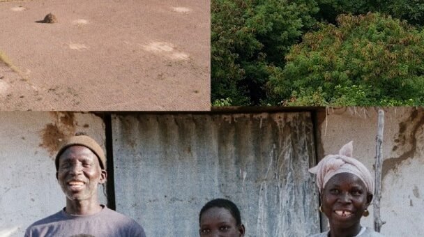 The Seck family smiling in front of their restored land in Senegal