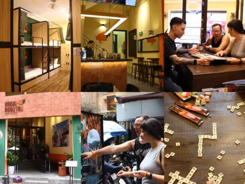 Volunteers interacting with travelers, playing games, and working at Rebelrooster Hostel in Hanoi’s Old Quarter, Vietnam
