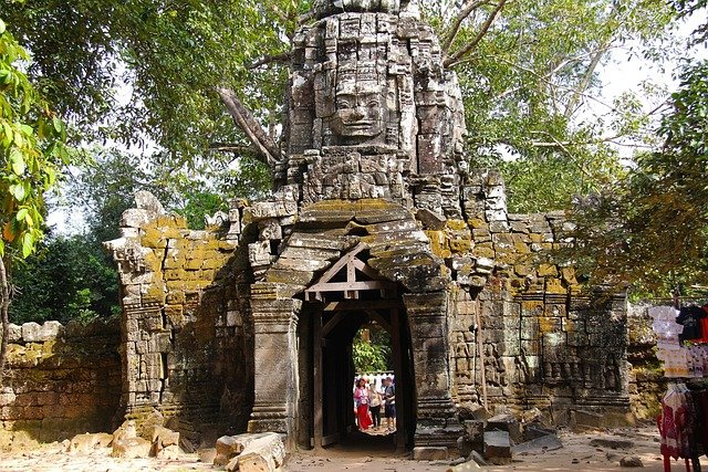 Stone entrance of Ta Som temple, featuring a face-tower in the Angkor archaeological park, Cambodia