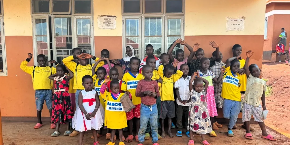 Group of children outside a community school in Bugembe, Jinja Uganda, part of Mothers and Children Uganda’s volunteer program