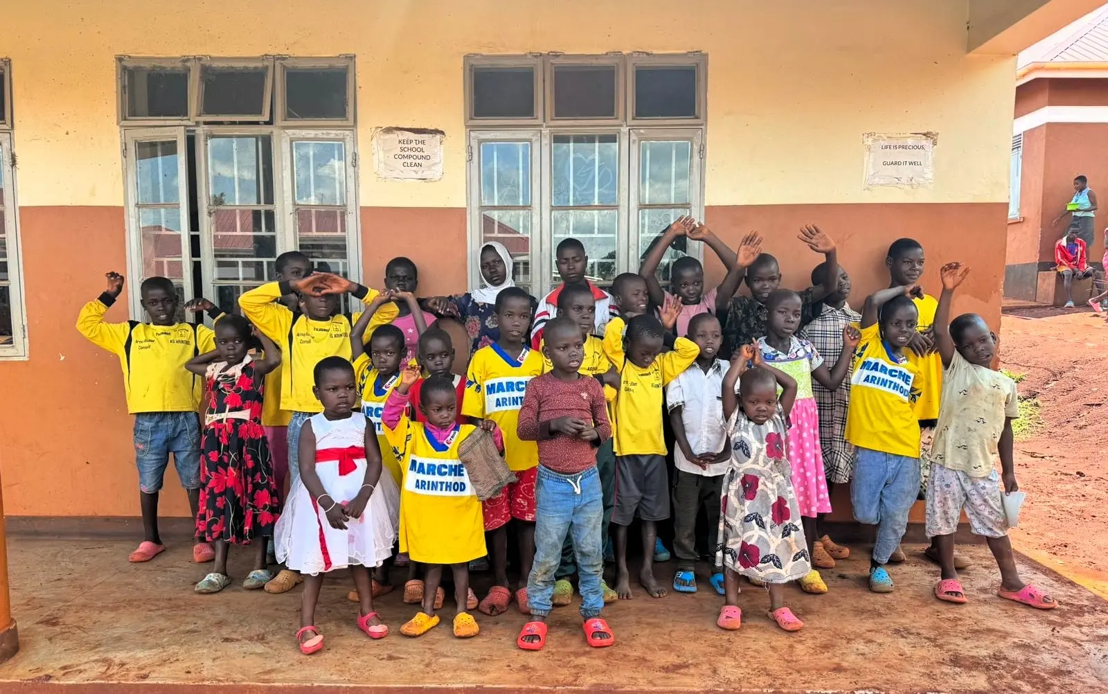 Group of children outside a community school in Bugembe, Jinja Uganda, part of Mothers and Children Uganda’s volunteer program