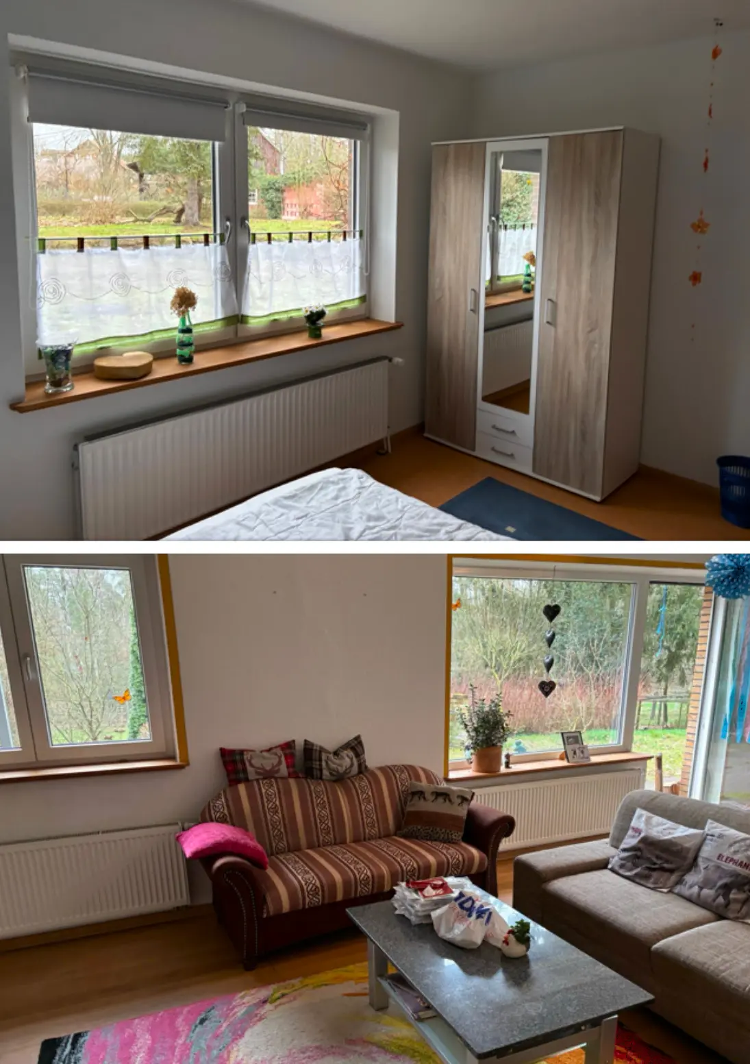 Volunteer accommodation at Hackspace Wendland in Germany. Bright bedroom with wardrobe and garden view, and cozy living room with sofas and large windows. FLINTA* queer volunteer project.