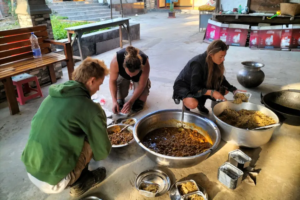 Volunteer in Manipur India at Langon Sanglen: volunteers preparing vegetarian meals together in the community kitchen near Imphal.