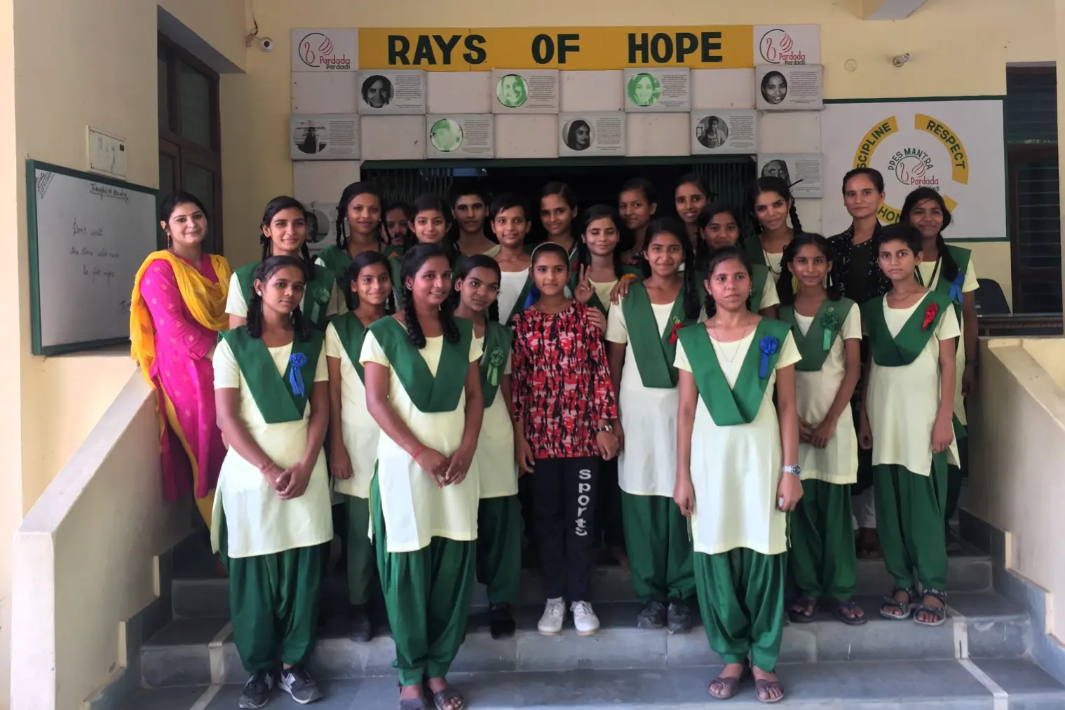 Group of schoolgirls in green uniforms with their teachers at a girls’ school in Anupshahr, Uttar Pradesh, India