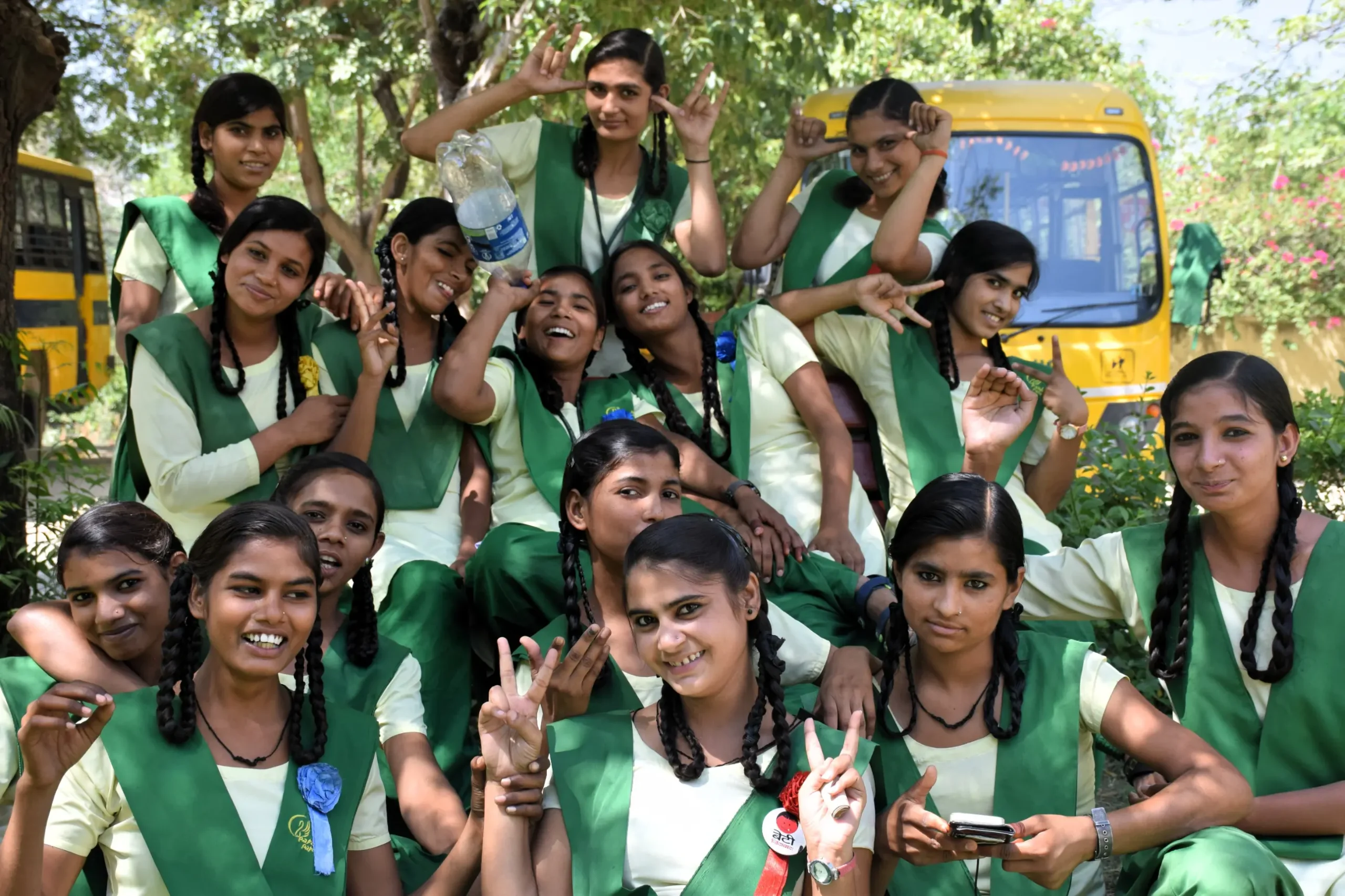Volunteer opportunity in rural India with smiling schoolgirls in green uniforms at a girls’ school in Anupshahr, Uttar Pradesh