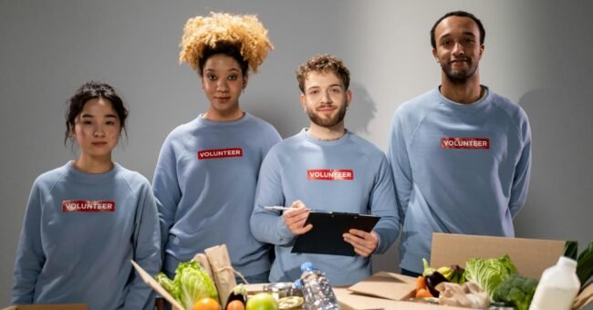 Volunteers organizing donated food supplies as part of a community support initiative