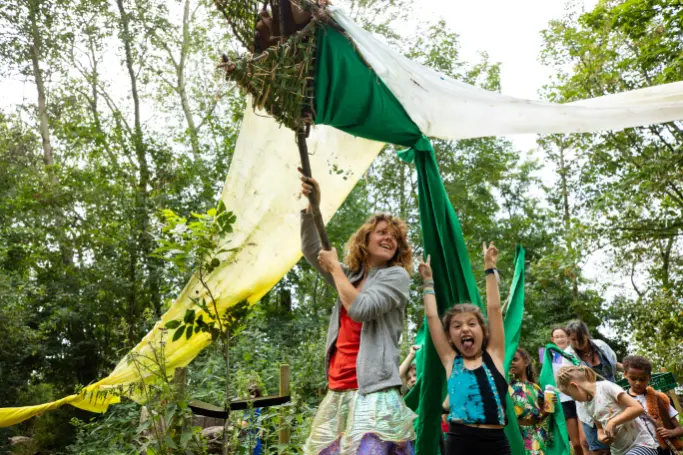 Outdoor activity with children at a supervised nature camp in Amsterdam, Netherlands.