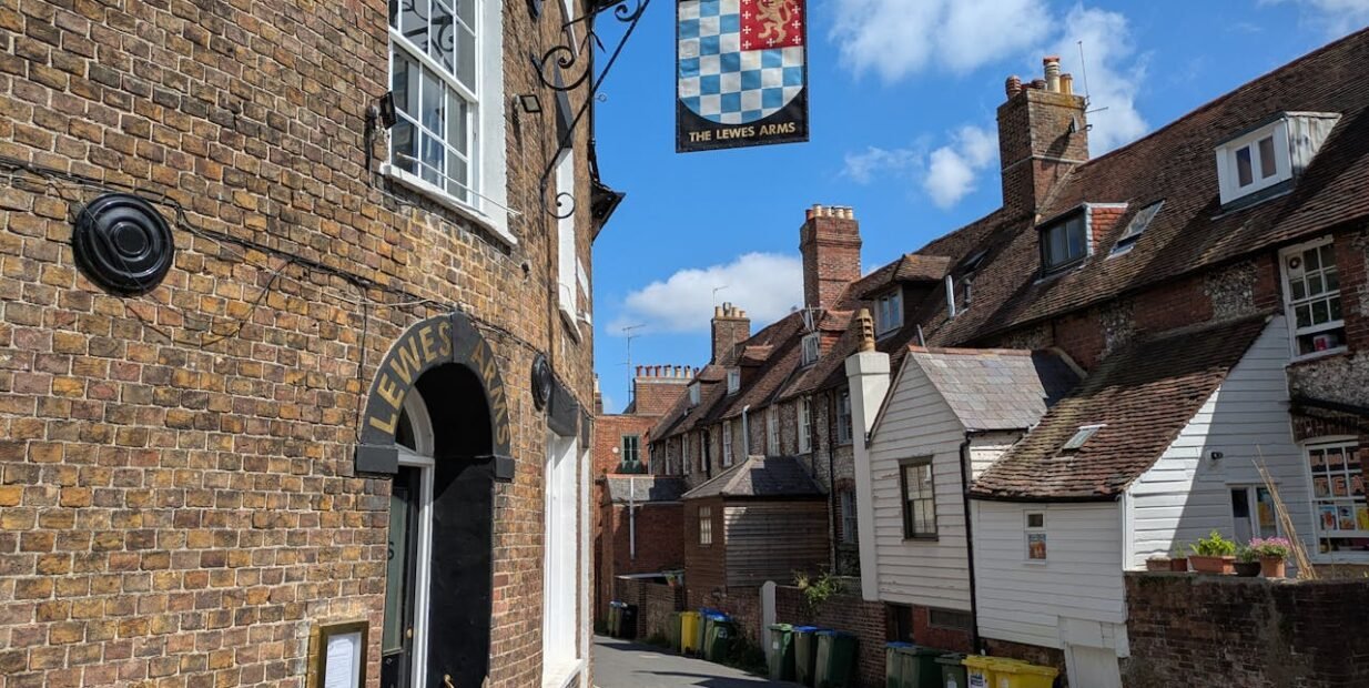 Traditional brick buildings on a narrow lane in Lewes, East Sussex, United Kingdom, close to the volunteer host location.
