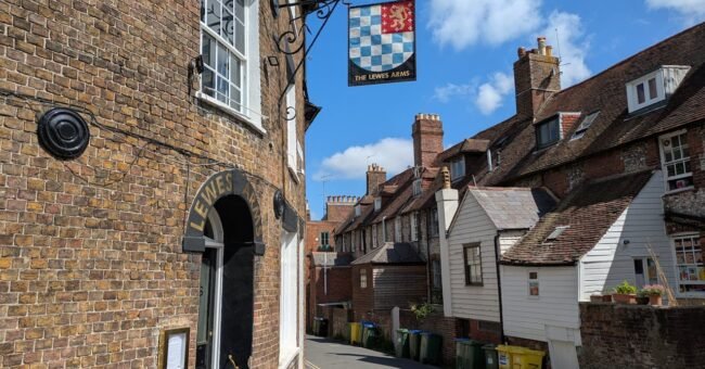 Traditional brick buildings on a narrow lane in Lewes, East Sussex, United Kingdom, close to the volunteer host location.