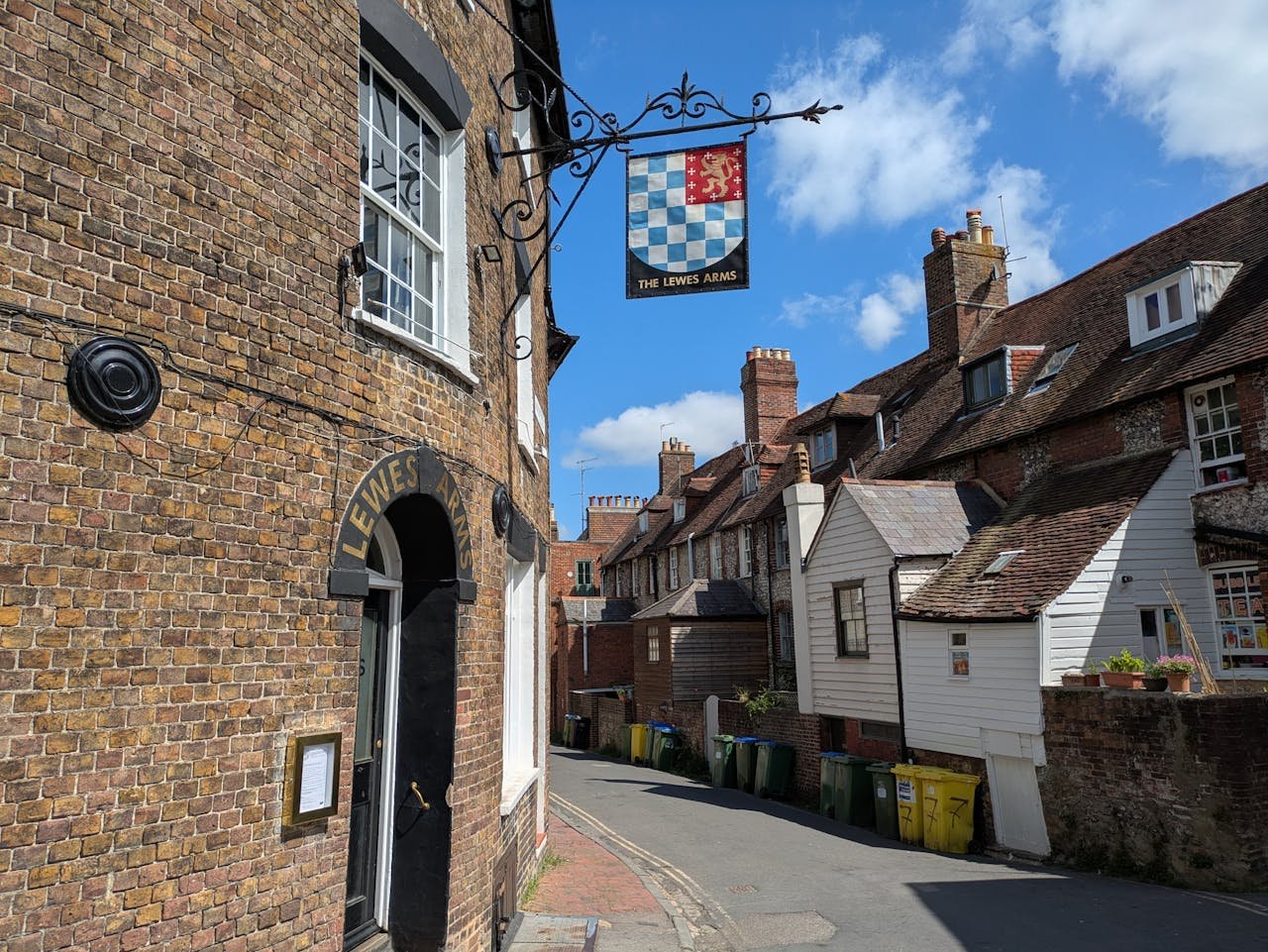 Traditional brick buildings on a narrow lane in Lewes, East Sussex, United Kingdom, close to the volunteer host location.