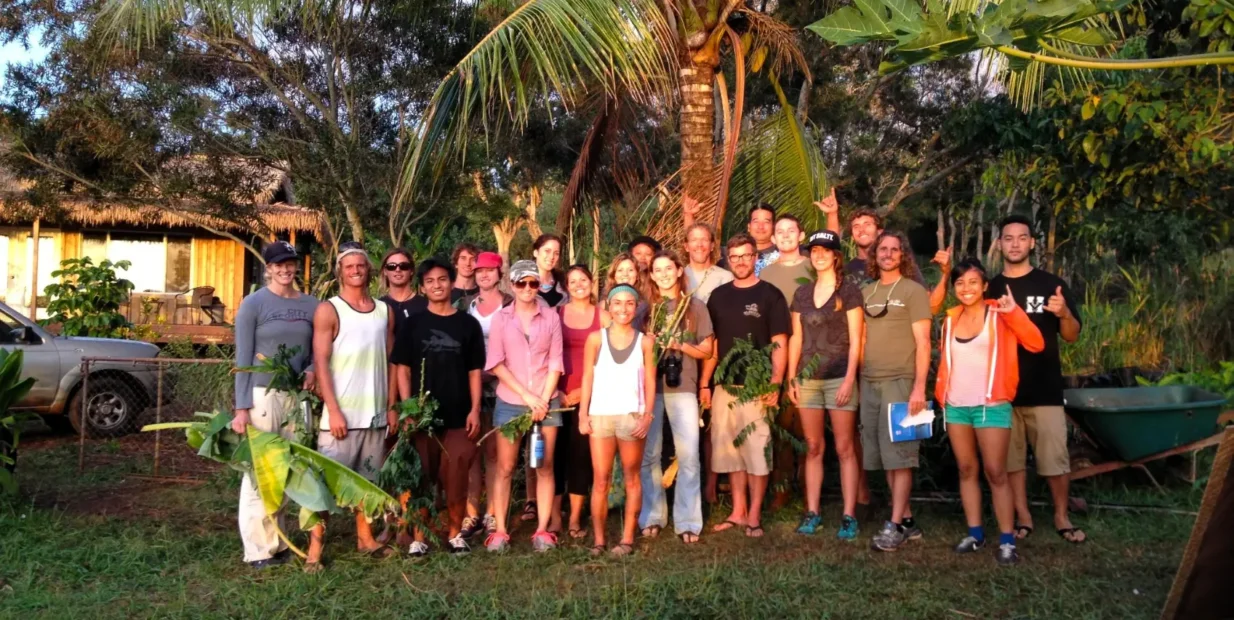 Group of volunteers at Kolea permaculture farm in Haleiwa, Hawaii, during a work exchange focused on organic farming, gardening, and community life