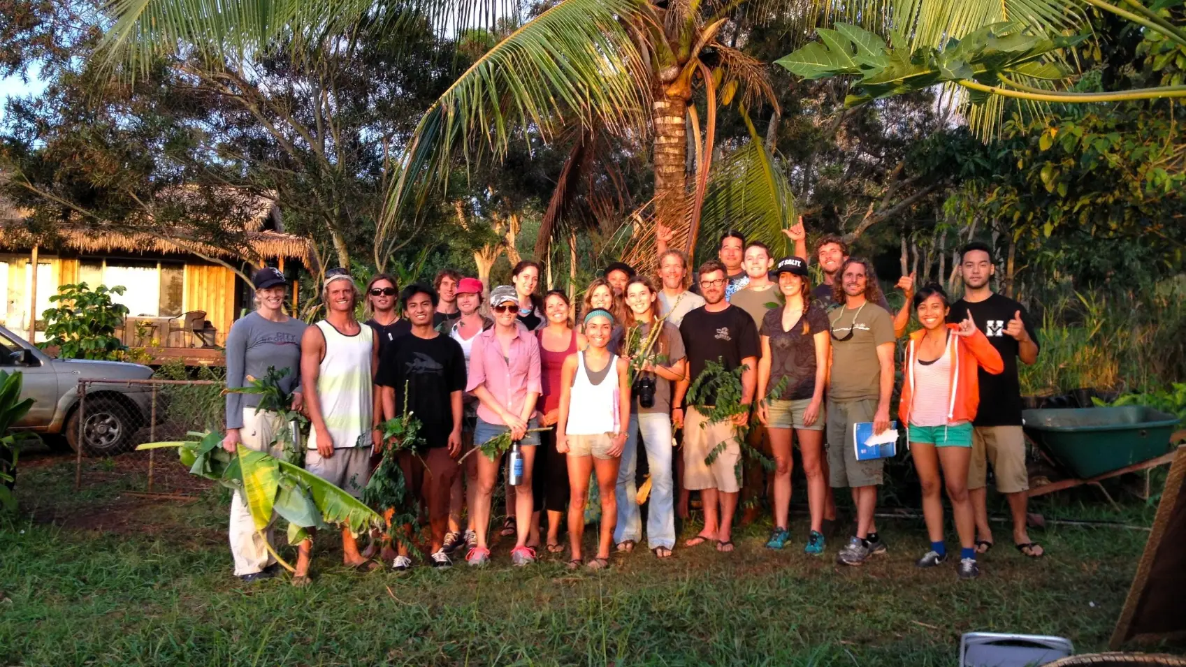 Group of volunteers at Kolea permaculture farm in Haleiwa, Hawaii, during a work exchange focused on organic farming, gardening, and community life