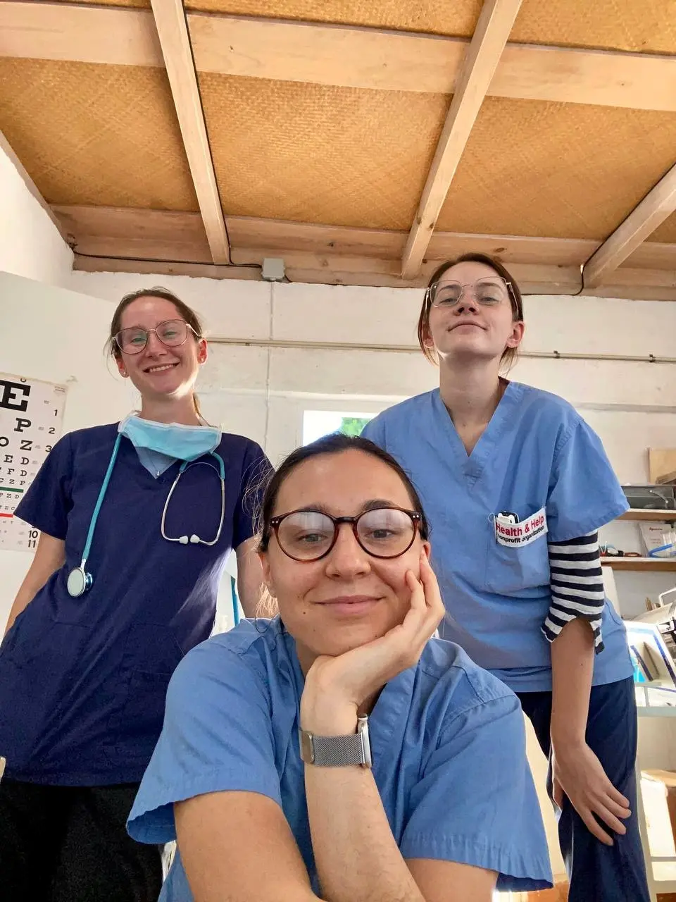 Health & Help medical volunteers in scrubs inside a rural healthcare clinic in Guatemala, supporting patient care and community health services in Totonicapán.