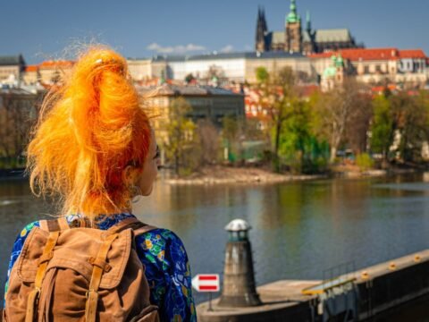 Volunteer in Prague with IYNF, young traveller overlooking the city skyline in the Czech Republic.