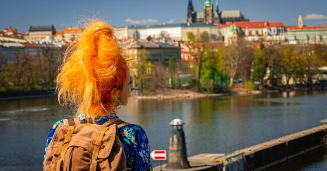 Volunteer in Prague with IYNF, young traveller overlooking the city skyline in the Czech Republic.