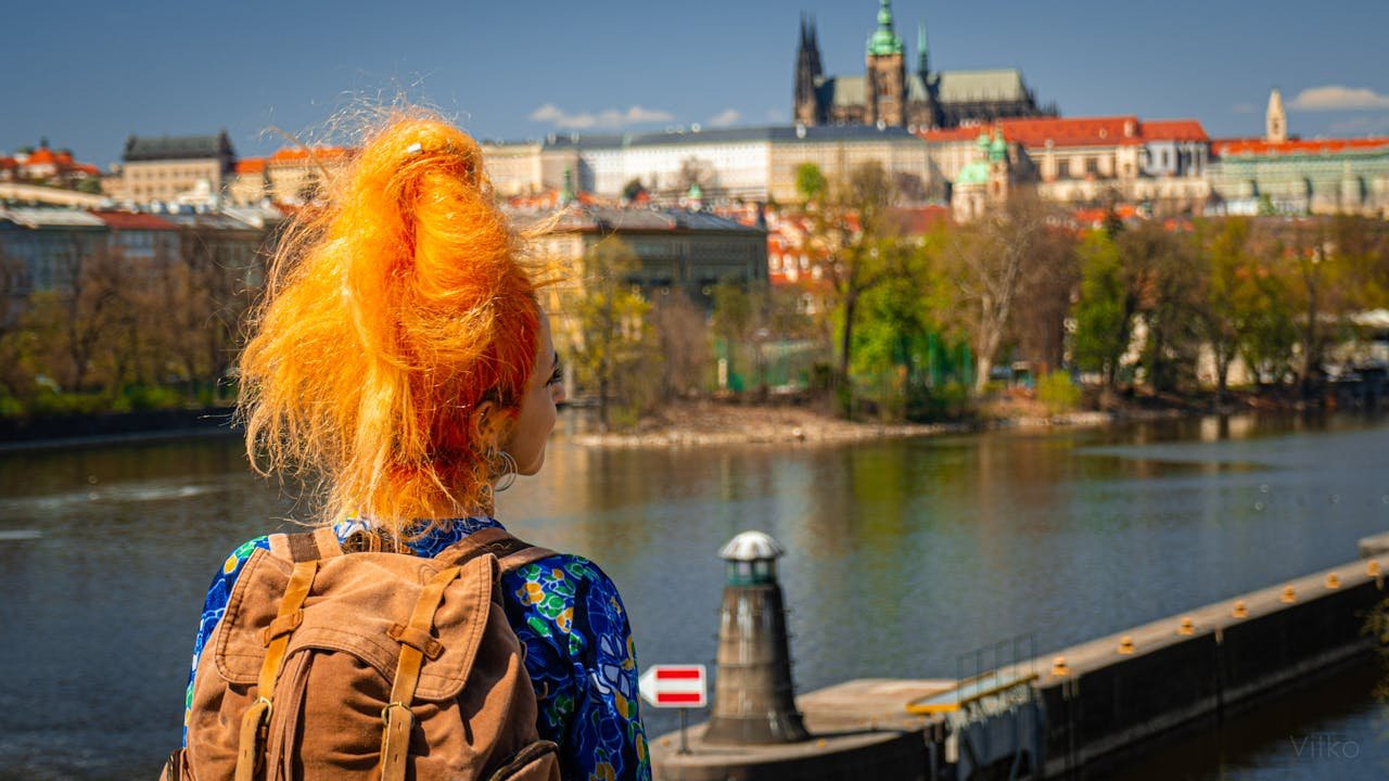 Volunteer in Prague with IYNF, young traveller overlooking the city skyline in the Czech Republic.