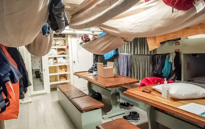 Shared sleeping area aboard the Götheborg wooden ship in Sweden, showing simple onboard accommodation for a ship volunteering opportunity.