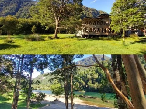 Salvatierra Lodge in Puerto Cisnes, Chilean Patagonia, surrounded by forest, mountains and a turquoise river.