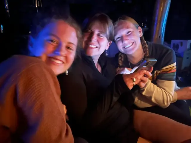 Three volunteers enjoying their free time together during a cultural and farm exchange stay in the Ardèche countryside