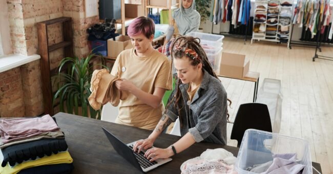 Volunteers organizing donations for a small nonprofit fundraising project