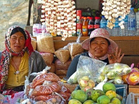 Two women selling fresh vegetables at a local market in Thimphu, Bhutan