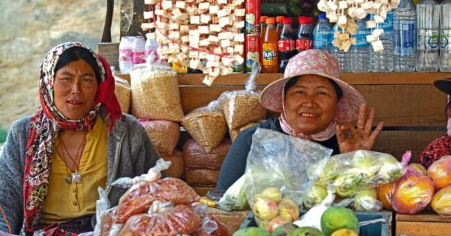 Two women selling fresh vegetables at a local market in Thimphu, Bhutan